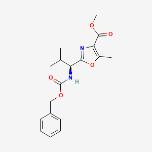 molecular formula C18H22N2O5 B2494448 methyl 2-[(1S)-1-{[(benzyloxy)carbonyl]amino}-2-methylpropyl]-5-methyl-1,3-oxazole-4-carboxylate CAS No. 182866-73-5