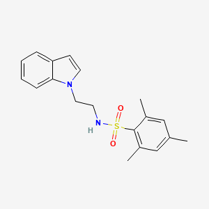 molecular formula C19H22N2O2S B2496767 N-[2-(1H-indol-1-yl)ethyl]-2,4,6-trimethylbenzene-1-sulfonamide CAS No. 689265-23-4