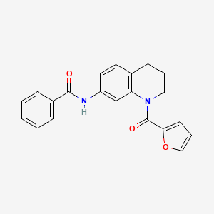 molecular formula C21H18N2O3 B2497621 N-[1-(furan-2-carbonyl)-1,2,3,4-tetrahydroquinolin-7-yl]benzamide CAS No. 946244-04-8