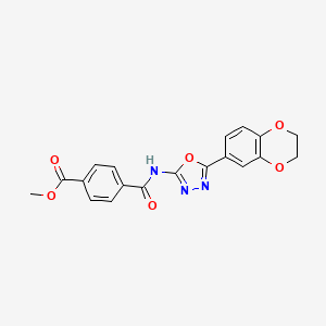 molecular formula C19H15N3O6 B2510235 Methyl 4-((5-(2,3-dihydrobenzo[b][1,4]dioxin-6-yl)-1,3,4-oxadiazol-2-yl)carbamoyl)benzoate CAS No. 887872-08-4