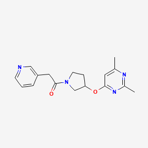 1-{3-[(2,6-Dimethylpyrimidin-4-yl)oxy]pyrrolidin-1-yl}-2-(pyridin-3-yl)ethan-1-one