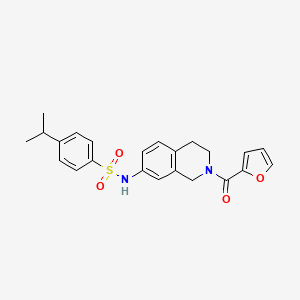 molecular formula C23H24N2O4S B2511202 N-(2-(furan-2-carbonyl)-1,2,3,4-tetrahydroisoquinolin-7-yl)-4-isopropylbenzenesulfonamide CAS No. 955650-10-9