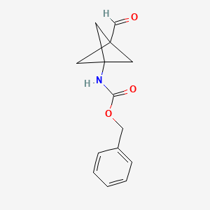 molecular formula C14H15NO3 B2514170 benzyl N-{3-formylbicyclo[1.1.1]pentan-1-yl}carbamate CAS No. 2166952-44-7