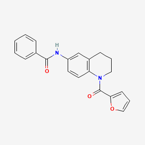 molecular formula C21H18N2O3 B2516772 N-[1-(furan-2-carbonyl)-1,2,3,4-tetrahydroquinolin-6-yl]benzamide CAS No. 942005-70-1