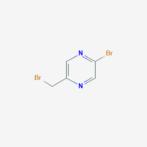 molecular formula C5H4Br2N2 B2526272 2-Bromo-5-(bromomethyl)pyrazine CAS No. 1382866-97-8