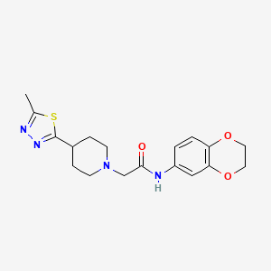 molecular formula C18H22N4O3S B2528716 N-(2,3-dihydro-1,4-benzodioxin-6-yl)-2-[4-(5-methyl-1,3,4-thiadiazol-2-yl)piperidin-1-yl]acetamide CAS No. 1323550-41-9