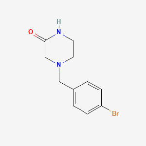 4-[(4-Bromophenyl)methyl]piperazin-2-one