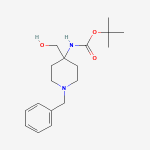 molecular formula C18H28N2O3 B2547743 tert-butyl N-[1-benzyl-4-(hydroxymethyl)piperidin-4-yl]carbamate CAS No. 1279815-88-1
