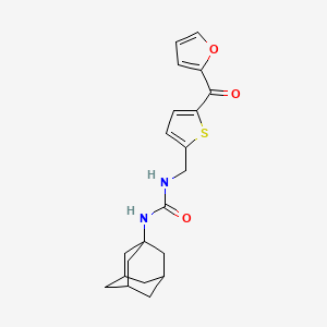 B2547871 1-((1R,3s)-adamantan-1-yl)-3-((5-(furan-2-carbonyl)thiophen-2-yl)methyl)urea CAS No. 1797141-28-6