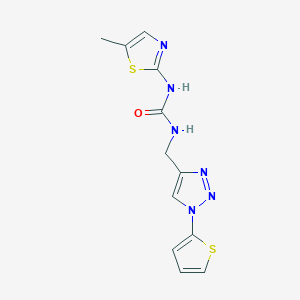 B2557079 1-(5-Methyl-1,3-thiazol-2-yl)-3-[(1-thiophen-2-yltriazol-4-yl)methyl]urea CAS No. 2379996-50-4
