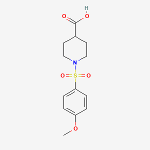 molecular formula C13H17NO5S B2557126 1-[(4-Methoxyphenyl)sulfonyl]-4-piperidinecarboxylic acid CAS No. 385398-15-2
