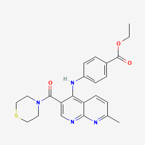 molecular formula C23H24N4O3S B2559507 Ethyl 4-{[7-methyl-3-(thiomorpholine-4-carbonyl)-1,8-naphthyridin-4-yl]amino}benzoate CAS No. 1251543-71-1