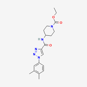 molecular formula C19H25N5O3 B2561533 ethyl 4-({[1-(3,4-dimethylphenyl)-1H-1,2,3-triazol-4-yl]carbonyl}amino)piperidine-1-carboxylate CAS No. 1326839-71-7