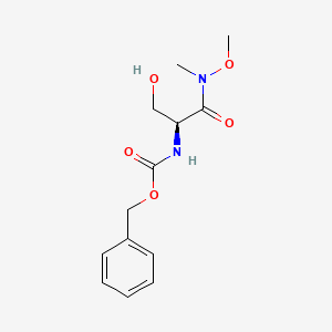 molecular formula C13H18N2O5 B2562436 Benzyl N-[(2S)-3-hydroxy-1-[methoxy(methyl)amino]-1-oxopropan-2-yl]carbamate CAS No. 684270-34-6