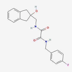 molecular formula C19H19FN2O3 B2568980 N'-[(4-fluorophenyl)methyl]-N-[(2-hydroxy-2,3-dihydro-1H-inden-2-yl)methyl]ethanediamide CAS No. 2034444-02-3