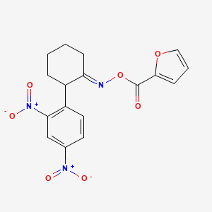 B2581339 2-[({[2-(2,4-Dinitrophenyl)cyclohexyliden]amino}oxy)carbonyl]furan CAS No. 383147-14-6