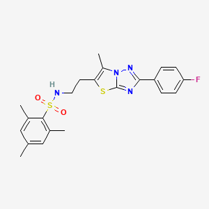 molecular formula C22H23FN4O2S2 B2581447 N-{2-[2-(4-fluorophenyl)-6-methyl-[1,2,4]triazolo[3,2-b][1,3]thiazol-5-yl]ethyl}-2,4,6-trimethylbenzene-1-sulfonamide CAS No. 896278-17-4