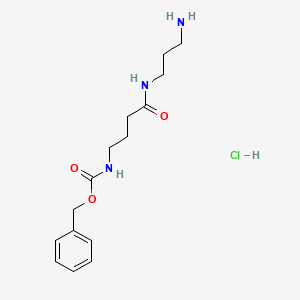 Benzyl N-{3-[(3-aminopropyl)carbamoyl]propyl}carbamate hydrochloride