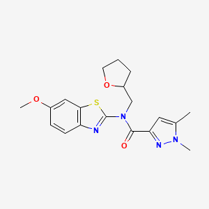 molecular formula C19H22N4O3S B2593378 N-(6-methoxy-1,3-benzothiazol-2-yl)-1,5-dimethyl-N-[(oxolan-2-yl)methyl]-1H-pyrazole-3-carboxamide CAS No. 1013783-19-1