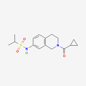 molecular formula C16H22N2O3S B2594700 N-(2-(cyclopropanecarbonyl)-1,2,3,4-tetrahydroisoquinolin-7-yl)propane-2-sulfonamide CAS No. 955746-60-8
