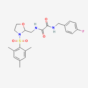 molecular formula C22H26FN3O5S B2594973 N1-(4-fluorobenzyl)-N2-((3-(mesitylsulfonyl)oxazolidin-2-yl)methyl)oxalamide CAS No. 868982-71-2