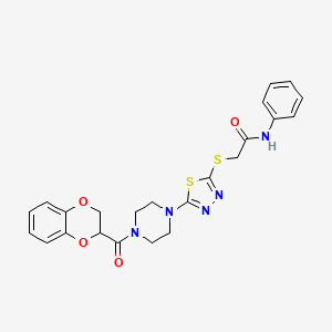 2-((5-(4-(2,3-dihydrobenzo[b][1,4]dioxine-2-carbonyl)piperazin-1-yl)-1,3,4-thiadiazol-2-yl)thio)-N-phenylacetamide