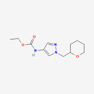 molecular formula C12H19N3O3 B2600695 ethyl (1-((tetrahydro-2H-pyran-2-yl)methyl)-1H-pyrazol-4-yl)carbamate CAS No. 2034321-61-2