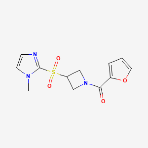 molecular formula C12H13N3O4S B2602357 furan-2-yl(3-((1-methyl-1H-imidazol-2-yl)sulfonyl)azetidin-1-yl)methanone CAS No. 2309571-45-5