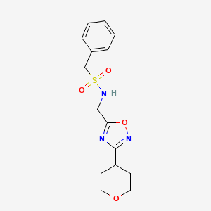 molecular formula C15H19N3O4S B2606918 N-{[3-(oxan-4-yl)-1,2,4-oxadiazol-5-yl]methyl}-1-phenylmethanesulfonamide CAS No. 2034291-76-2