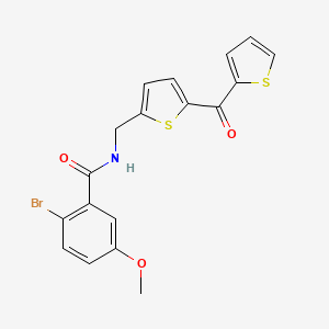 2-bromo-5-methoxy-N-((5-(thiophene-2-carbonyl)thiophen-2-yl)methyl)benzamide