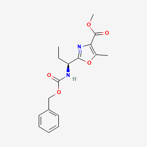 molecular formula C17H20N2O5 B2613304 methyl 2-[(1S)-1-{[(benzyloxy)carbonyl]amino}propyl]-5-methyl-1,3-oxazole-4-carboxylate CAS No. 1418114-05-2