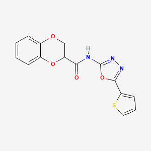 molecular formula C15H11N3O4S B2619830 N-(5-(thiophen-2-yl)-1,3,4-oxadiazol-2-yl)-2,3-dihydrobenzo[b][1,4]dioxine-2-carboxamide CAS No. 865288-07-9