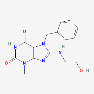 molecular formula C15H17N5O3 B2621780 7-Benzyl-8-(2-hydroxyethylamino)-3-methylpurine-2,6-dione CAS No. 106306-89-2