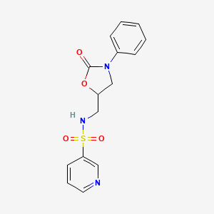 molecular formula C15H15N3O4S B2628364 N-[(2-oxo-3-phenyl-1,3-oxazolidin-5-yl)methyl]pyridine-3-sulfonamide CAS No. 955223-78-6