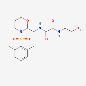 B2638698 N1-(2-hydroxyethyl)-N2-((3-(mesitylsulfonyl)-1,3-oxazinan-2-yl)methyl)oxalamide CAS No. 872975-88-7