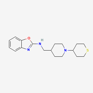 B2640107 N-[[1-(Thian-4-yl)piperidin-4-yl]methyl]-1,3-benzoxazol-2-amine CAS No. 2379985-69-8