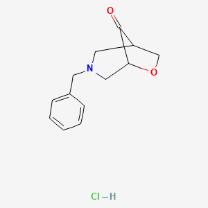 3-Benzyl-6-oxa-3-azabicyclo[3.2.1]octan-8-one;hydrochloride