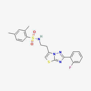 molecular formula C20H19FN4O2S2 B2646989 N-{2-[2-(2-fluorophenyl)-[1,2,4]triazolo[3,2-b][1,3]thiazol-6-yl]ethyl}-2,4-dimethylbenzene-1-sulfonamide CAS No. 946306-28-1