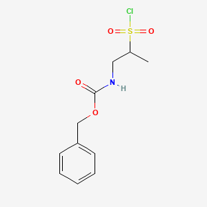 molecular formula C11H14ClNO4S B2649827 (2-Chlorosulfonyl-propyl)-carbamic acid benzyl ester CAS No. 1781036-07-4