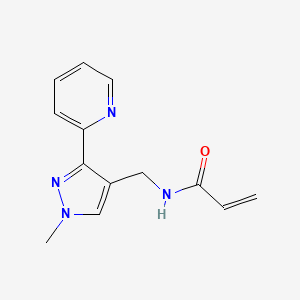 molecular formula C13H14N4O B2653272 N-{[1-methyl-3-(pyridin-2-yl)-1H-pyrazol-4-yl]methyl}prop-2-enamide CAS No. 2411252-04-3