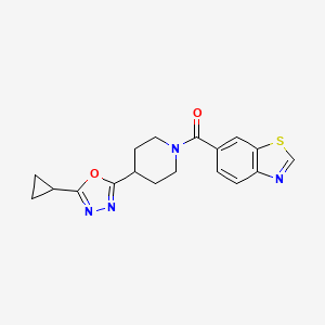 molecular formula C18H18N4O2S B2653598 Benzo[d]thiazol-6-yl(4-(5-cyclopropyl-1,3,4-oxadiazol-2-yl)piperidin-1-yl)methanone CAS No. 1210284-65-3