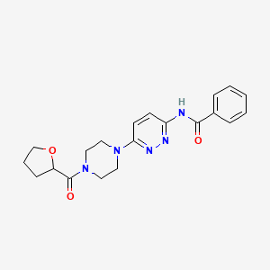 molecular formula C20H23N5O3 B2656655 N-{6-[4-(oxolane-2-carbonyl)piperazin-1-yl]pyridazin-3-yl}benzamide CAS No. 1105210-55-6