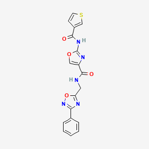 molecular formula C18H13N5O4S B2665937 N-((3-phenyl-1,2,4-oxadiazol-5-yl)methyl)-2-(thiophene-3-carboxamido)oxazole-4-carboxamide CAS No. 1351596-34-3
