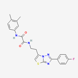 molecular formula C22H20FN5O2S B2666244 N1-(3,4-dimethylphenyl)-N2-(2-(2-(4-fluorophenyl)thiazolo[3,2-b][1,2,4]triazol-6-yl)ethyl)oxalamide CAS No. 894033-69-3