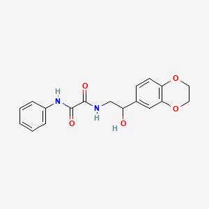 molecular formula C18H18N2O5 B2672116 N-[2-(2,3-dihydro-1,4-benzodioxin-6-yl)-2-hydroxyethyl]-N'-phenylethanediamide CAS No. 2034568-80-2
