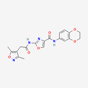 molecular formula C19H18N4O6 B2673560 N-(2,3-dihydro-1,4-benzodioxin-6-yl)-2-[2-(3,5-dimethyl-1,2-oxazol-4-yl)acetamido]-1,3-oxazole-4-carboxamide CAS No. 1797060-14-0