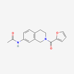 molecular formula C16H16N2O3 B2679041 N-(2-(furan-2-carbonyl)-1,2,3,4-tetrahydroisoquinolin-7-yl)acetamide CAS No. 955686-08-5