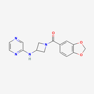 molecular formula C15H14N4O3 B2684697 Benzo[d][1,3]dioxol-5-yl(3-(pyrazin-2-ylamino)azetidin-1-yl)methanone CAS No. 2320663-71-4