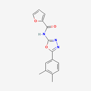molecular formula C15H13N3O3 B2693409 N-[5-(3,4-dimethylphenyl)-1,3,4-oxadiazol-2-yl]furan-2-carboxamide CAS No. 922961-25-9