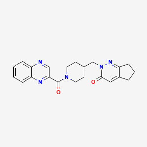 B2693947 2-{[1-(quinoxaline-2-carbonyl)piperidin-4-yl]methyl}-2H,3H,5H,6H,7H-cyclopenta[c]pyridazin-3-one CAS No. 2201320-84-3
